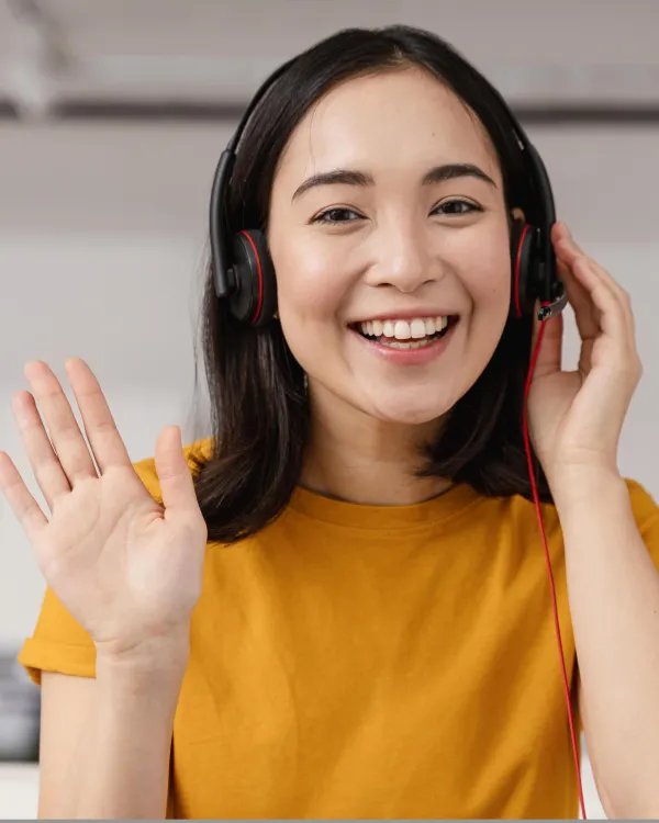 A person waving on a video call